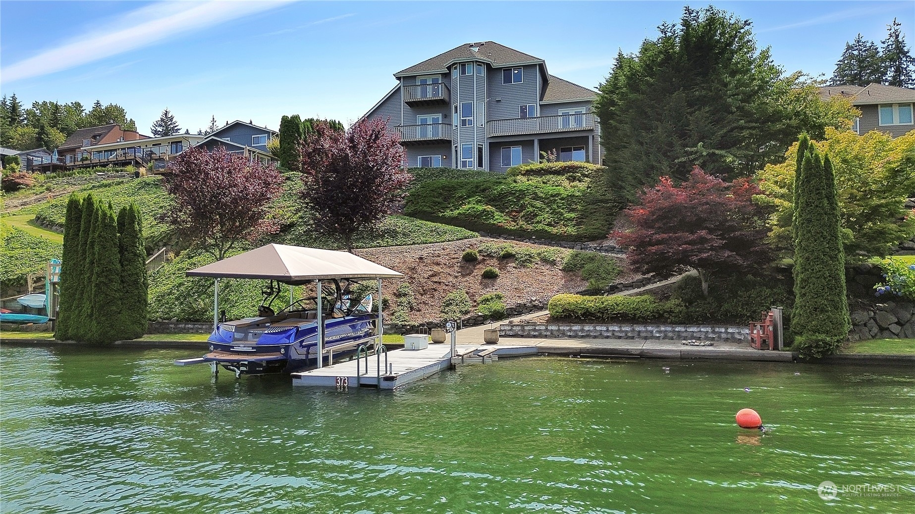 a swimming pool with outdoor seating and yard