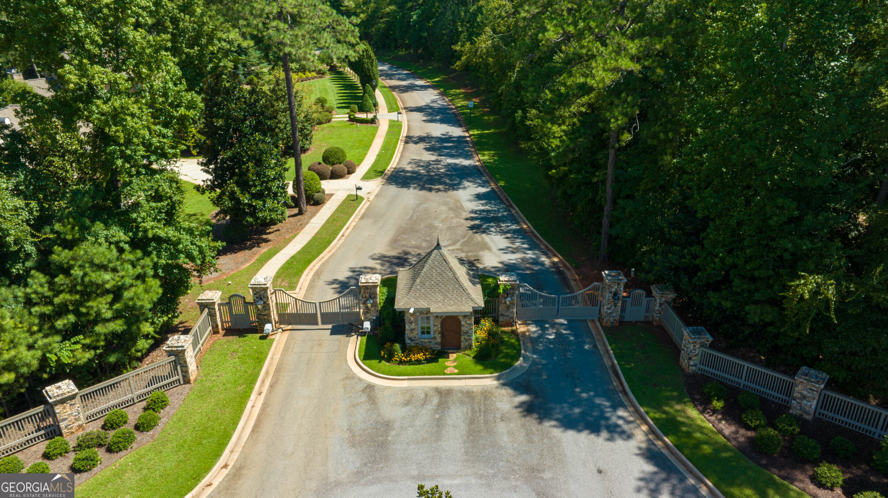 an aerial view of a house with swimming pool