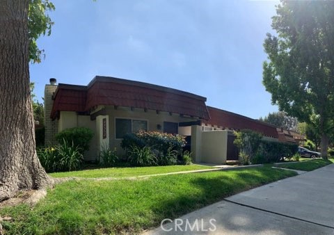 a view of a house with garden and yard