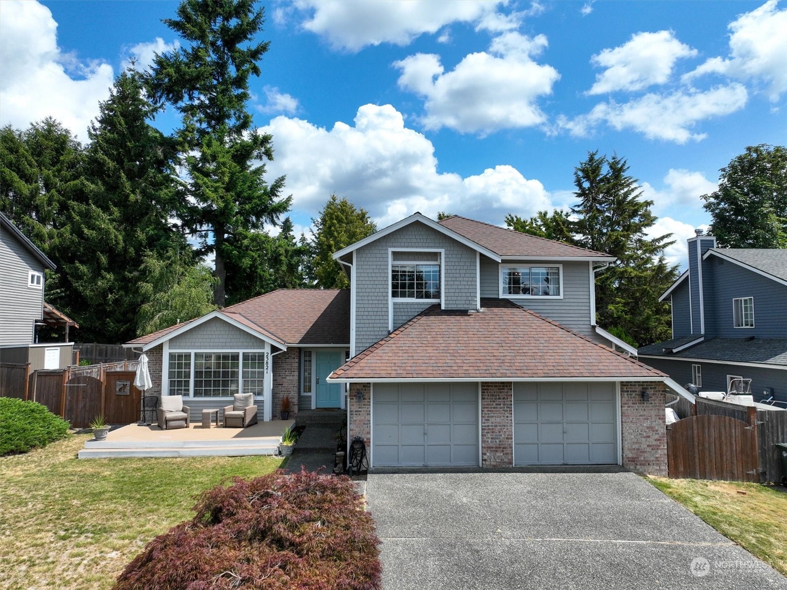 a front view of a house with garden