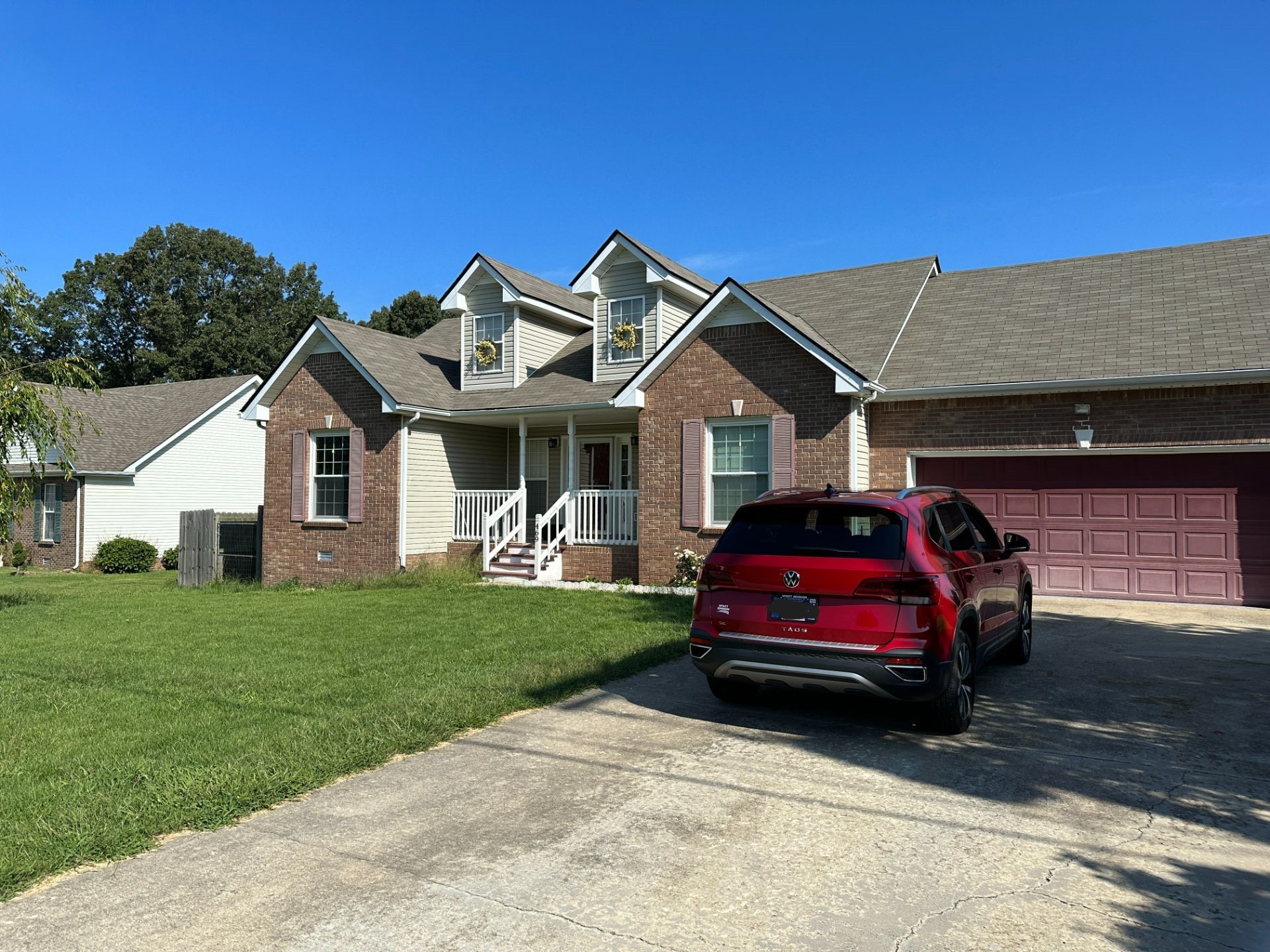 a car parked in front of a house