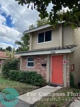 a front view of a house with yard