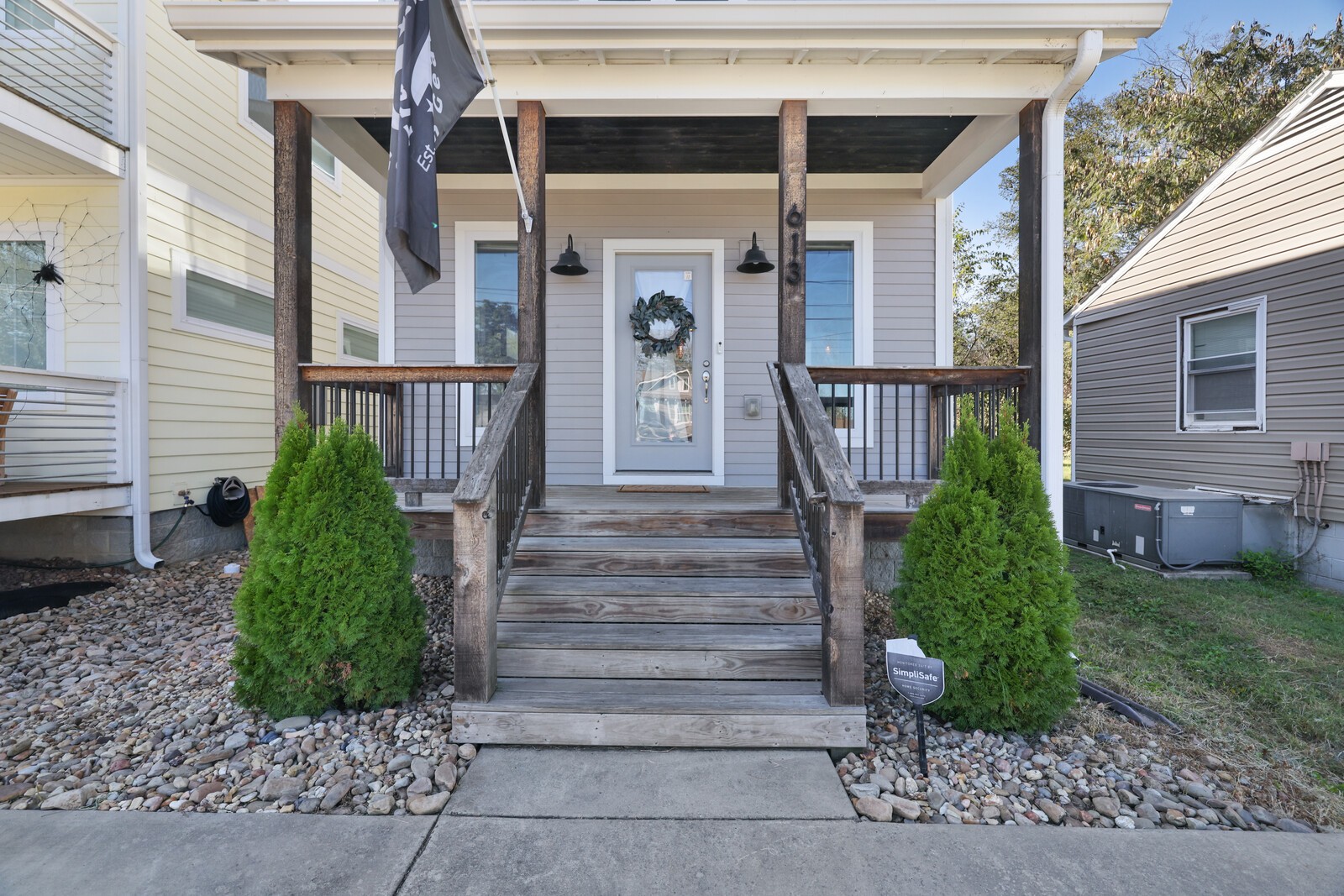 a view of a house with a small yard and plants