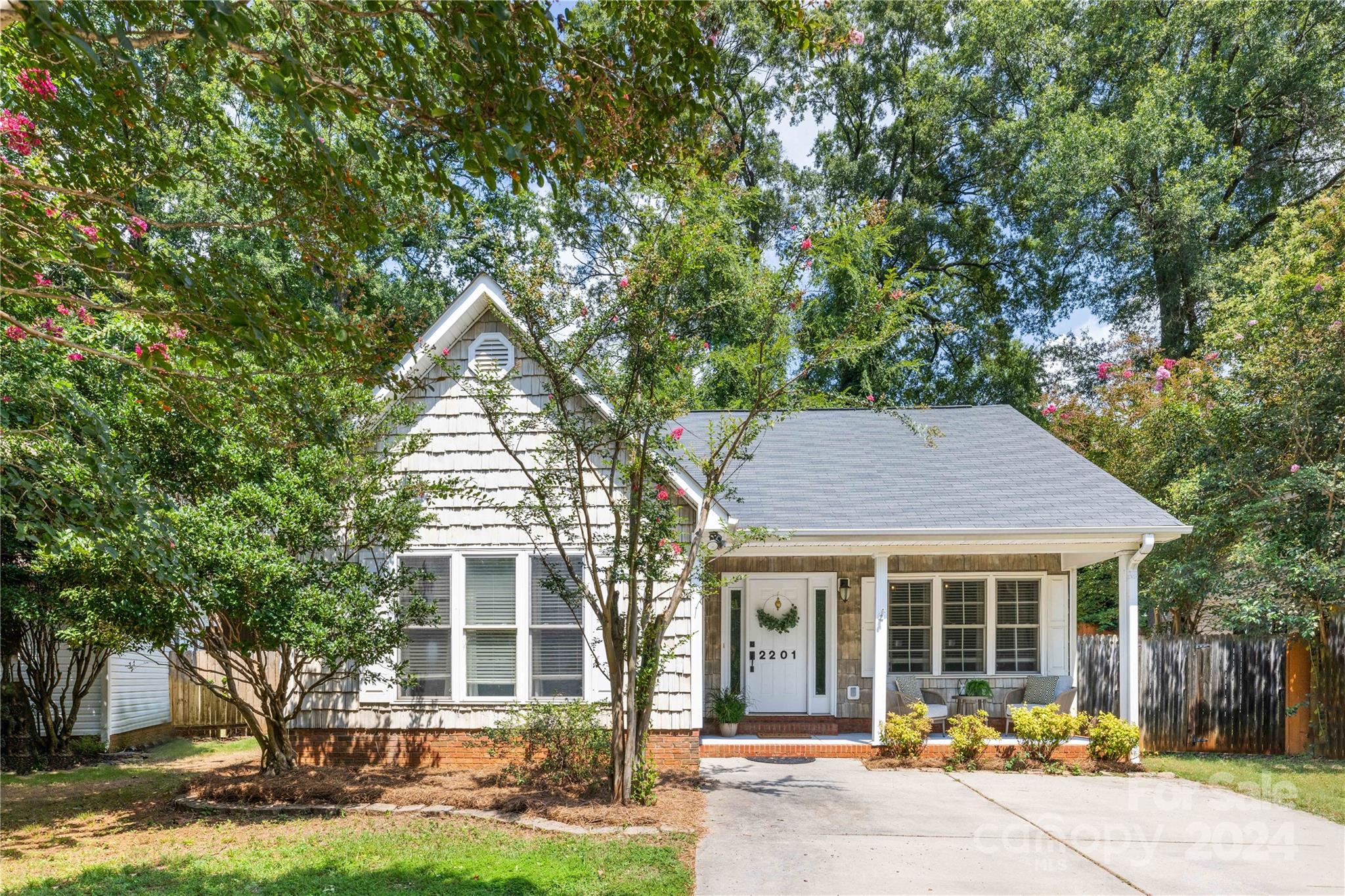 front view of a house with a yard