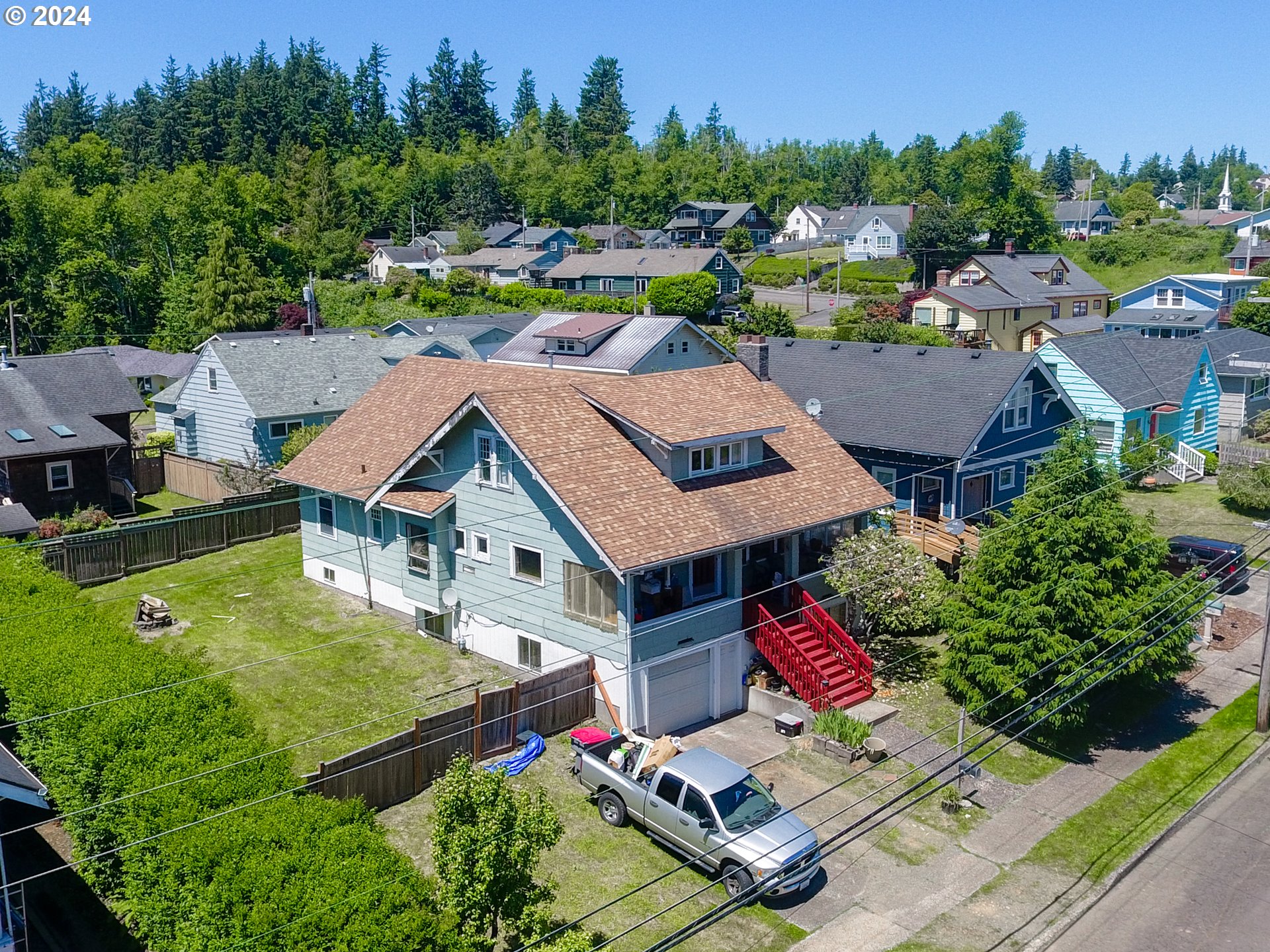 an aerial view of a house with swimming pool garden and outdoor seating