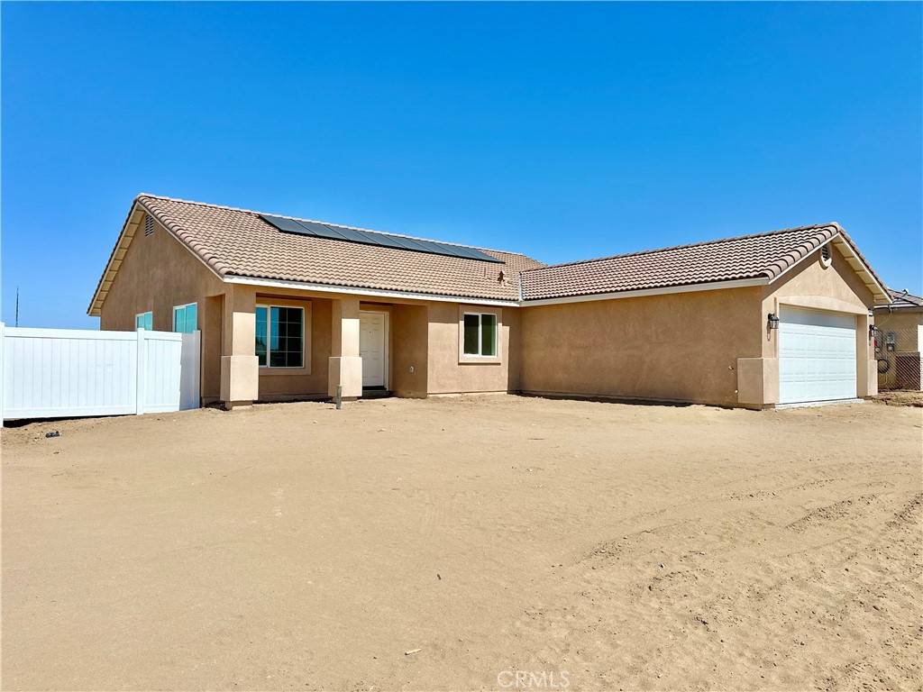 a front view of a house with a garage