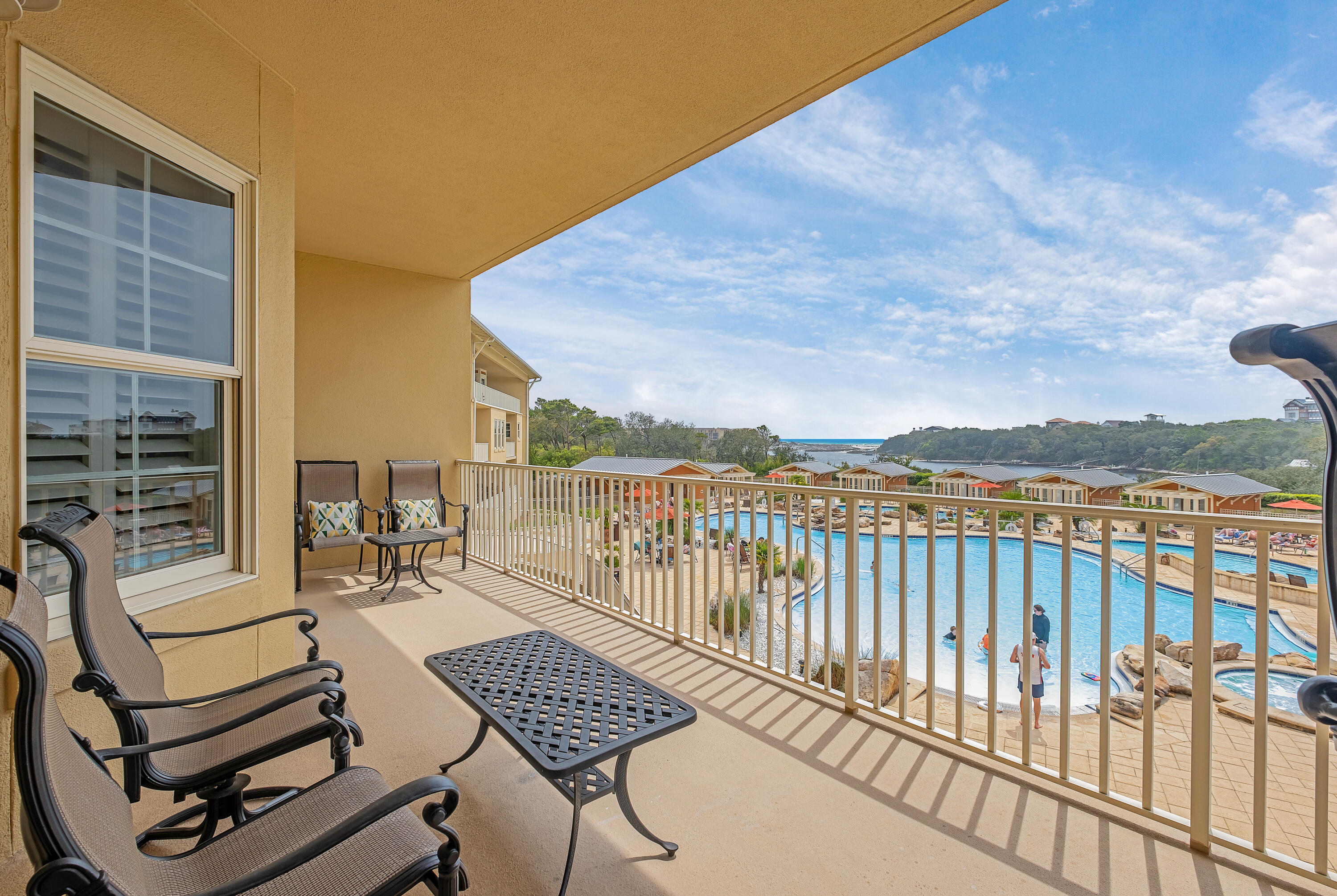 a view of a balcony with two chairs and a table