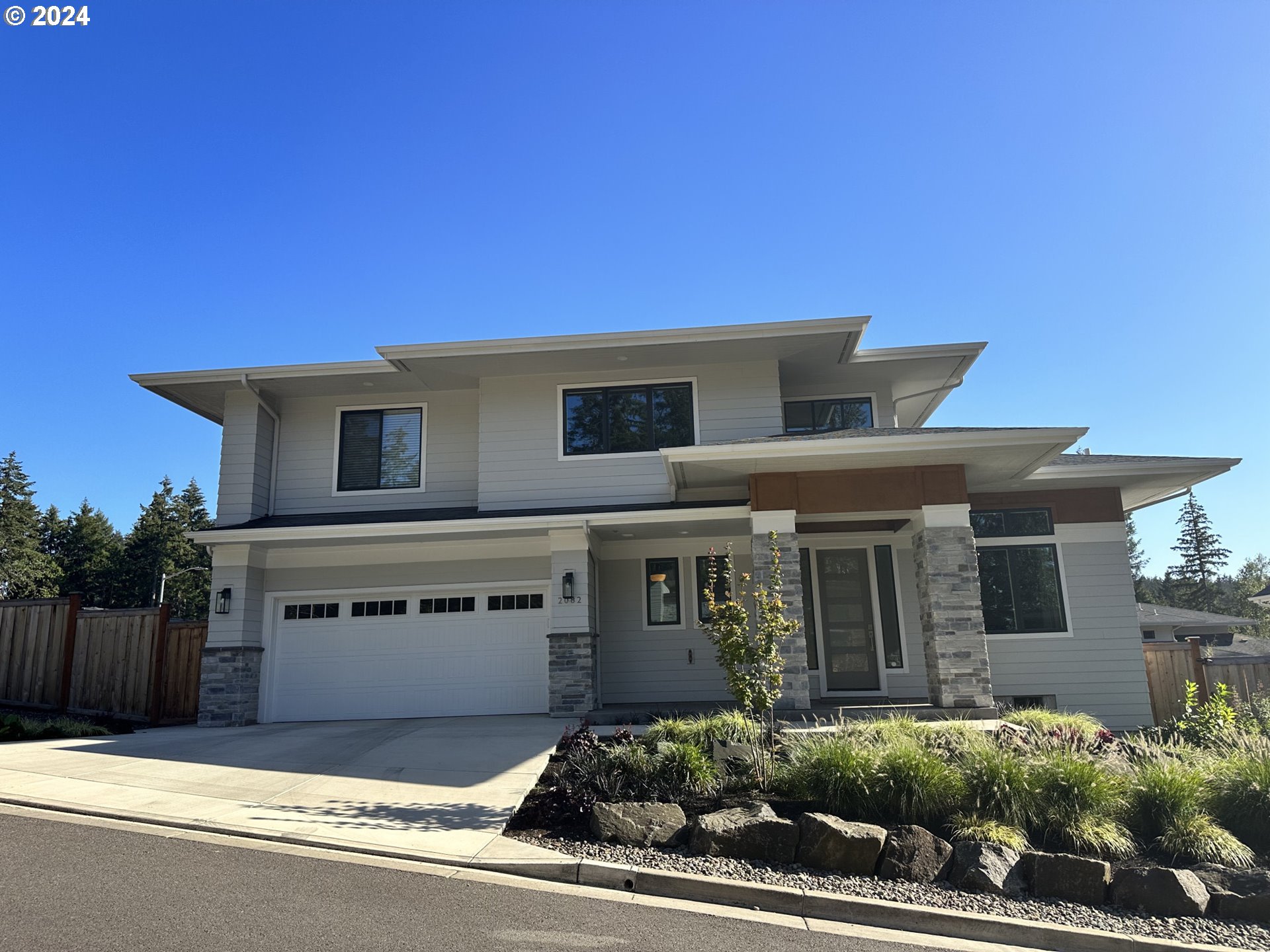 a front view of a house with a garage