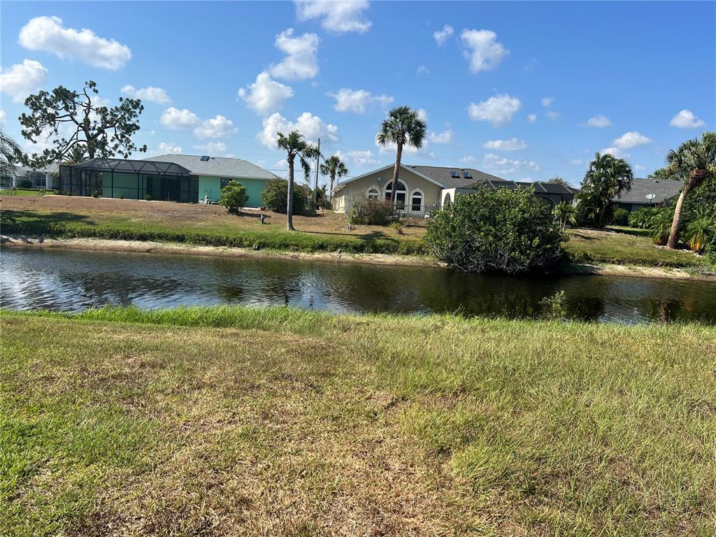 a front view of a house with a lake view