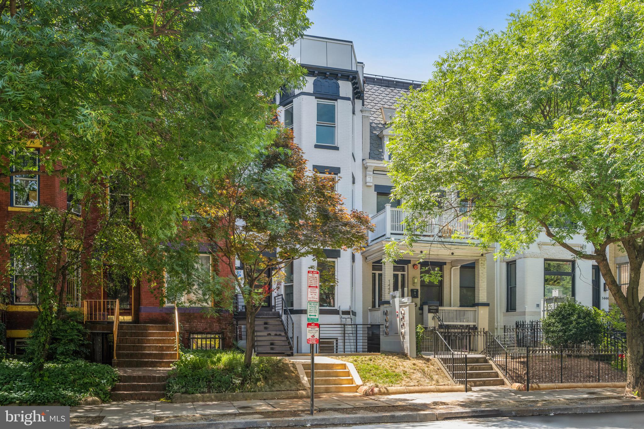 a front view of a building with street view