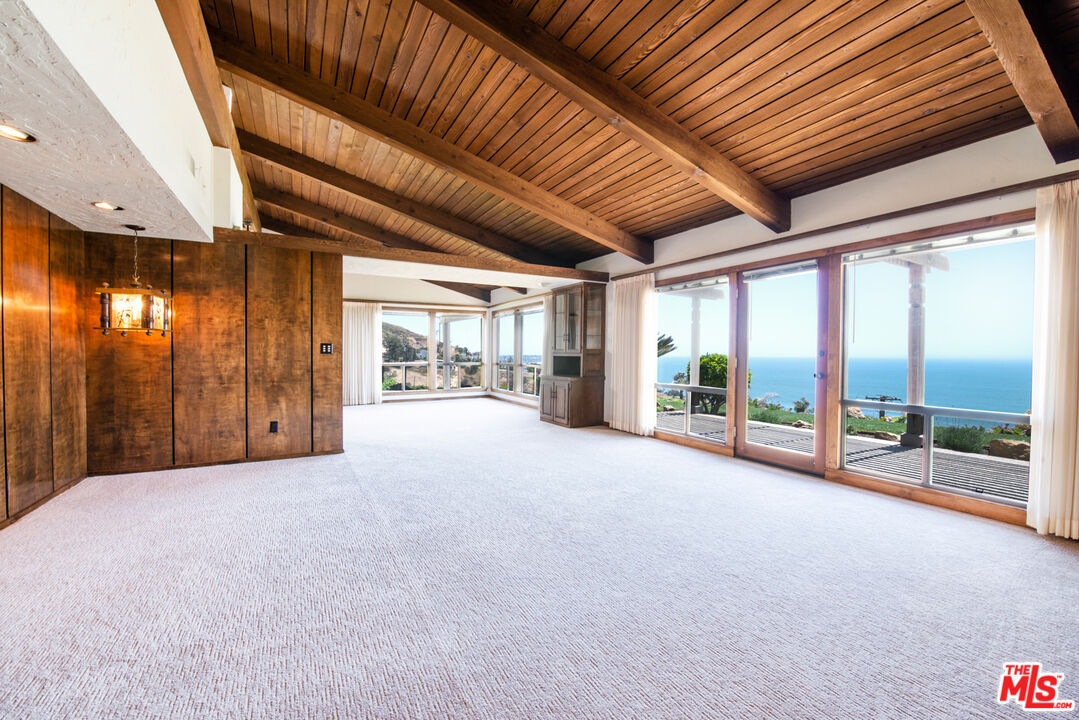 a view of an empty room with a sliding door