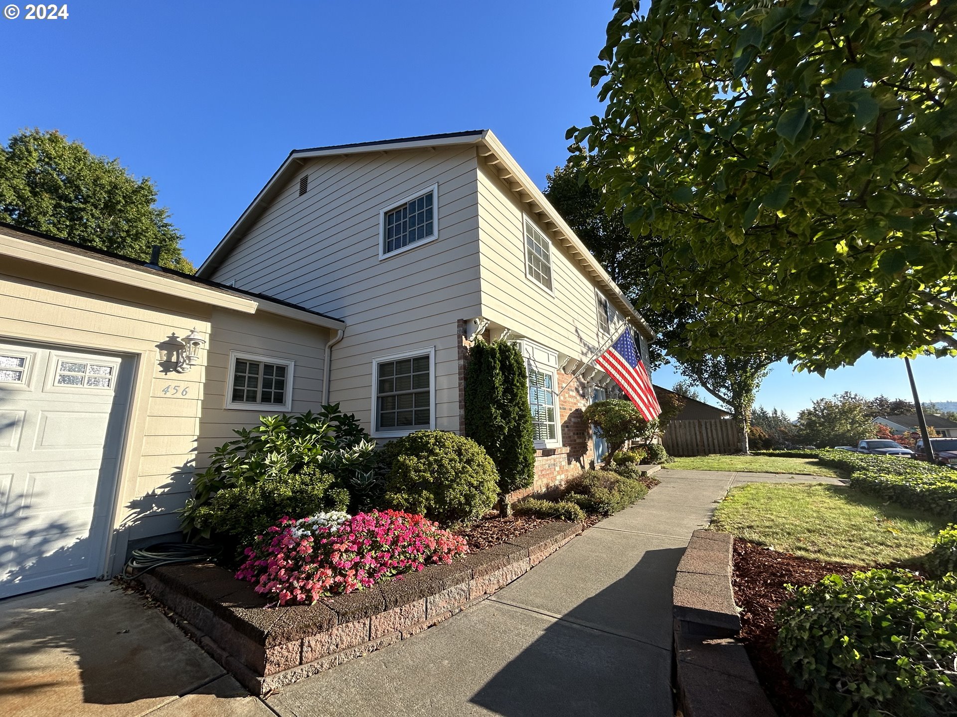 a front view of a house with garden