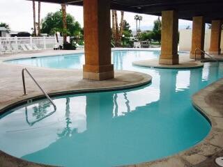 a view of swimming pool from a balcony