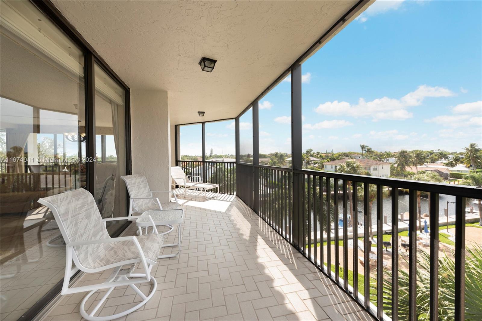 a view of balcony with furniture