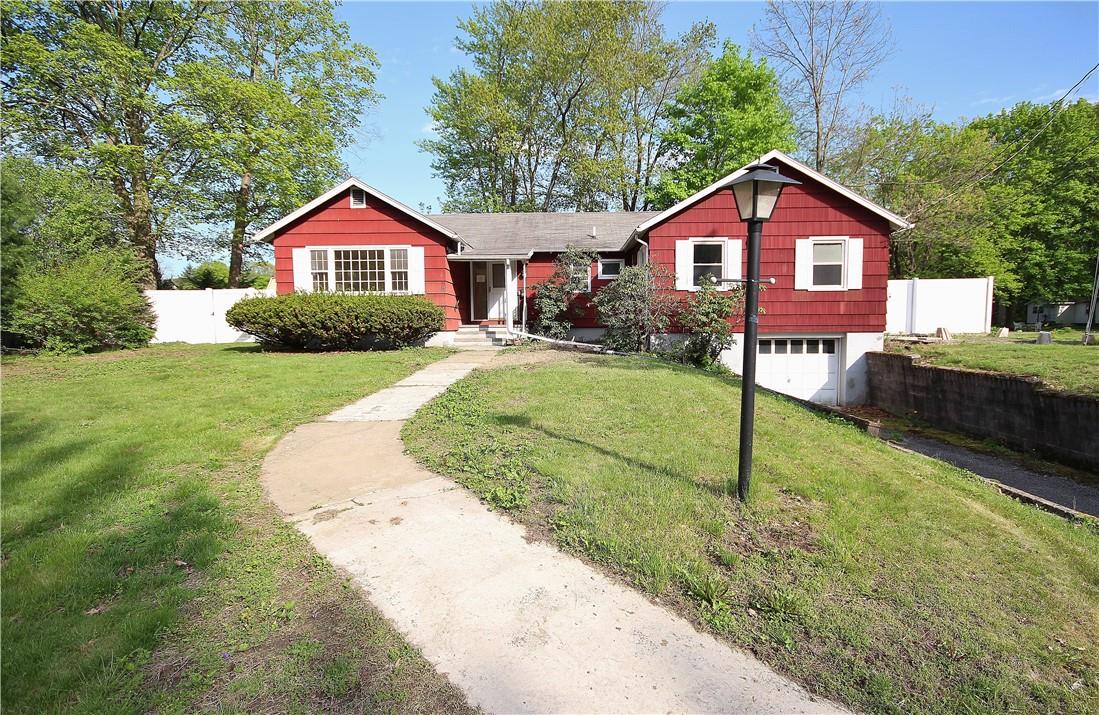 a front view of a house with yard