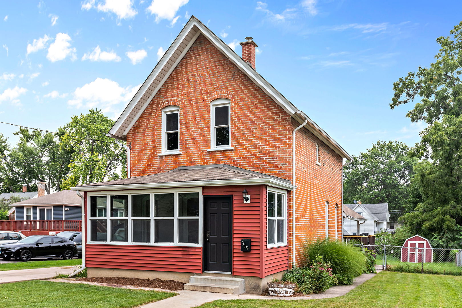 a front view of a house with garden