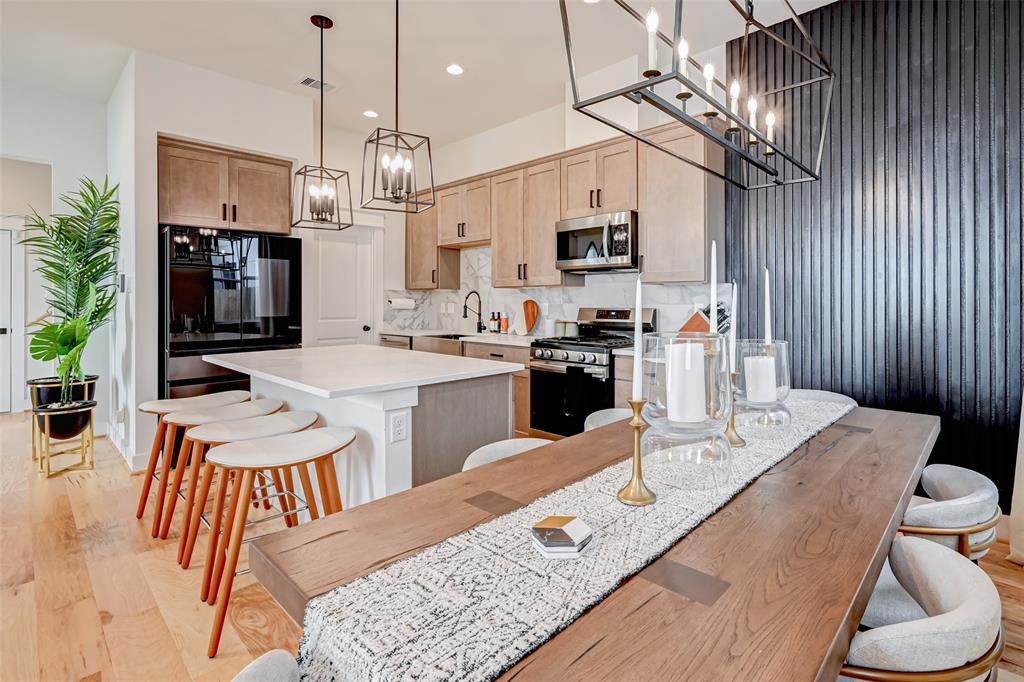 This stunning home presents like a model! *Note living and dining room fixtures removed. Pendant lights replaced over island replaced. Refrig replaced*