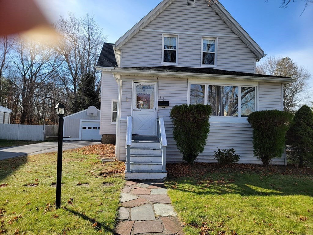 a front view of a house with garden