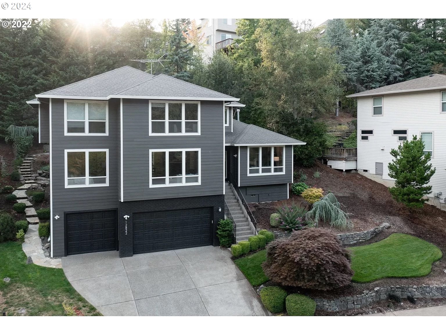 a aerial view of a house with a yard