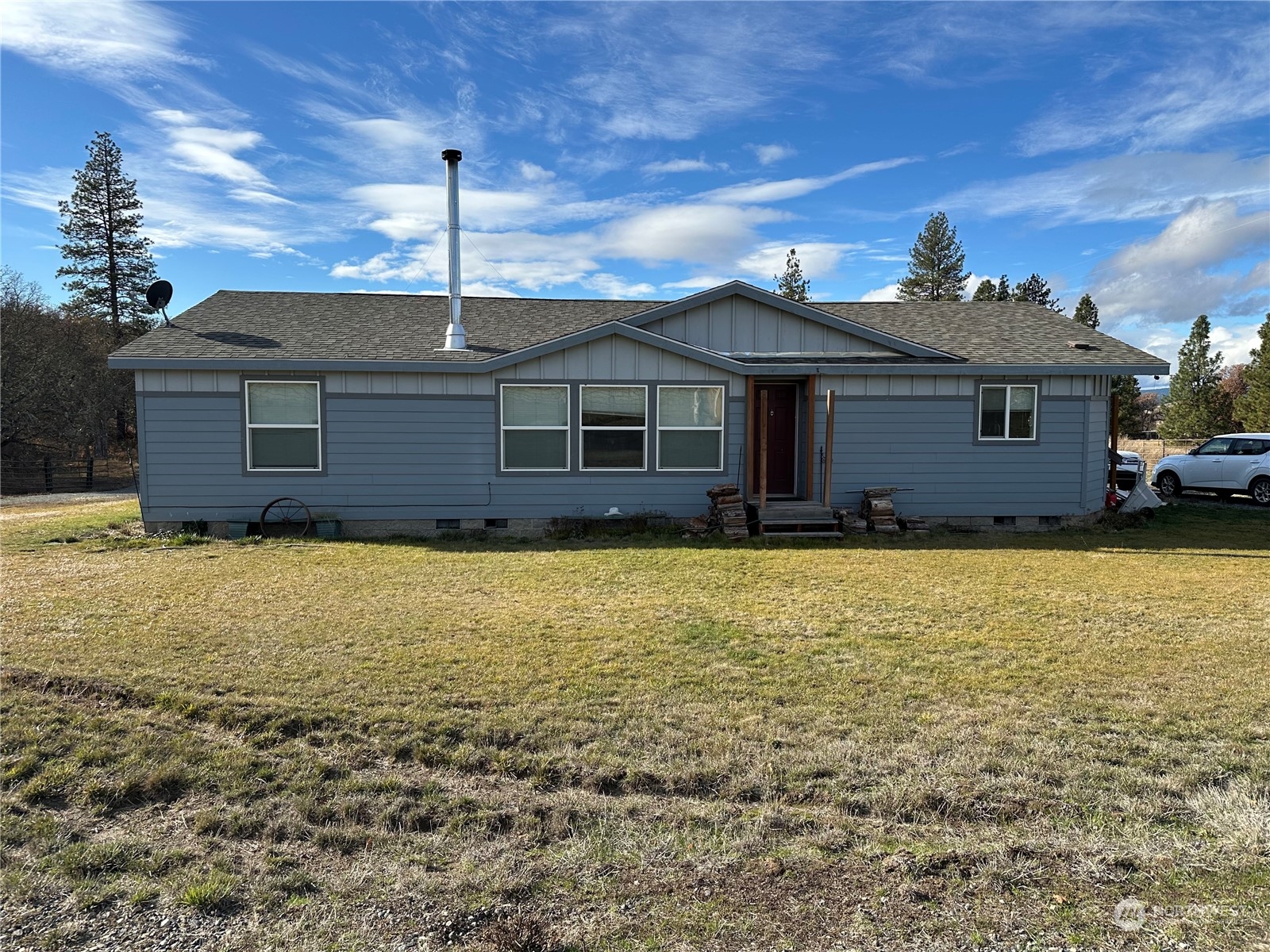 a front view of a house with a yard