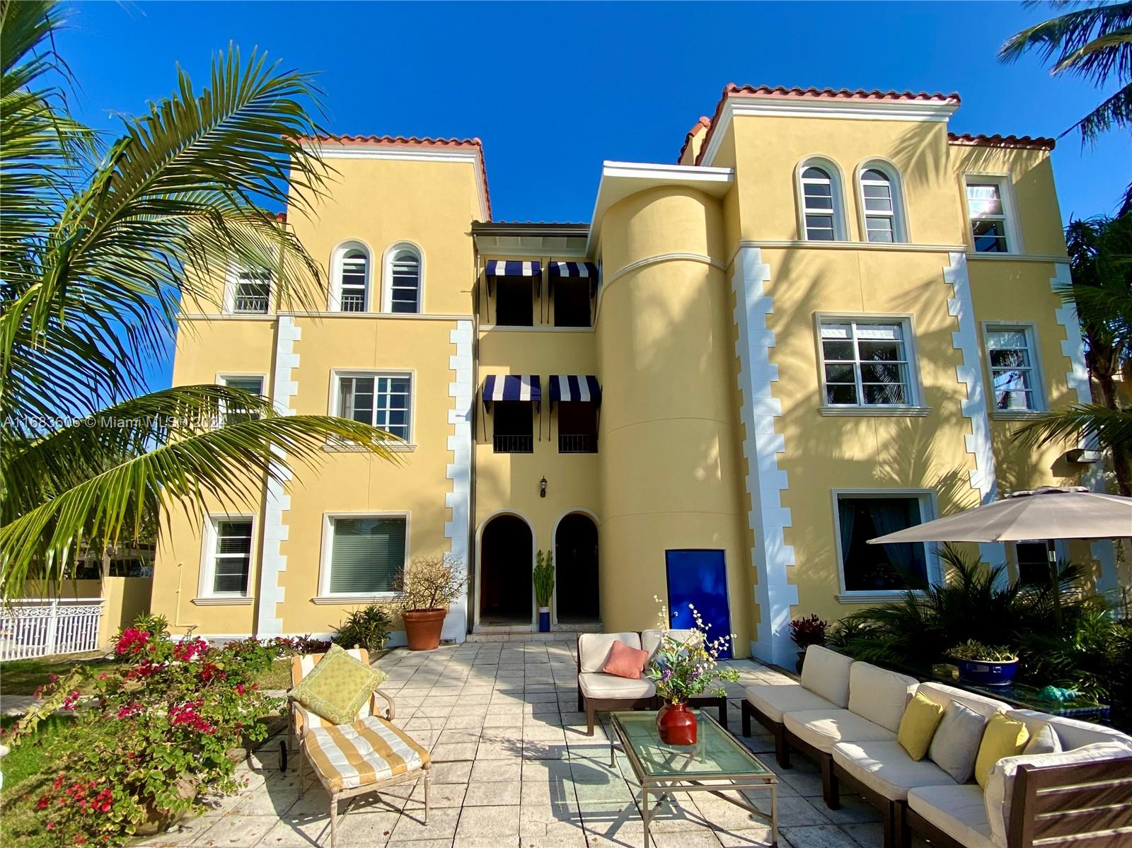 a front view of multiple house with outdoor seating