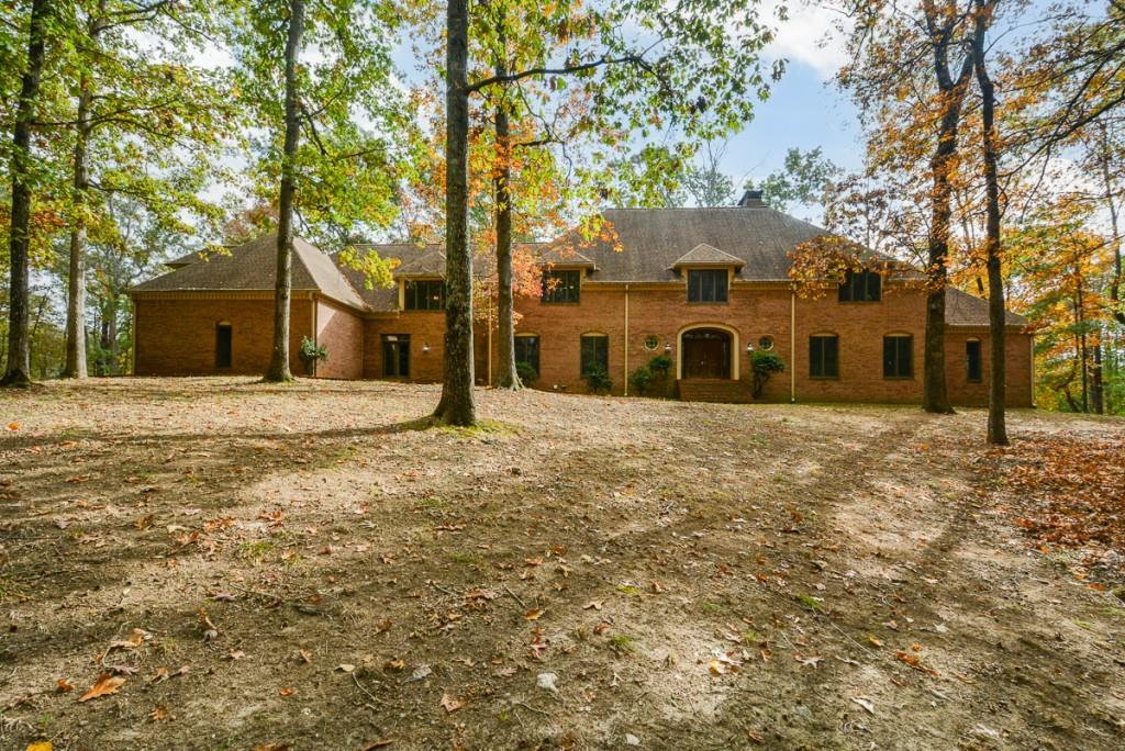 front view of a house with a large trees