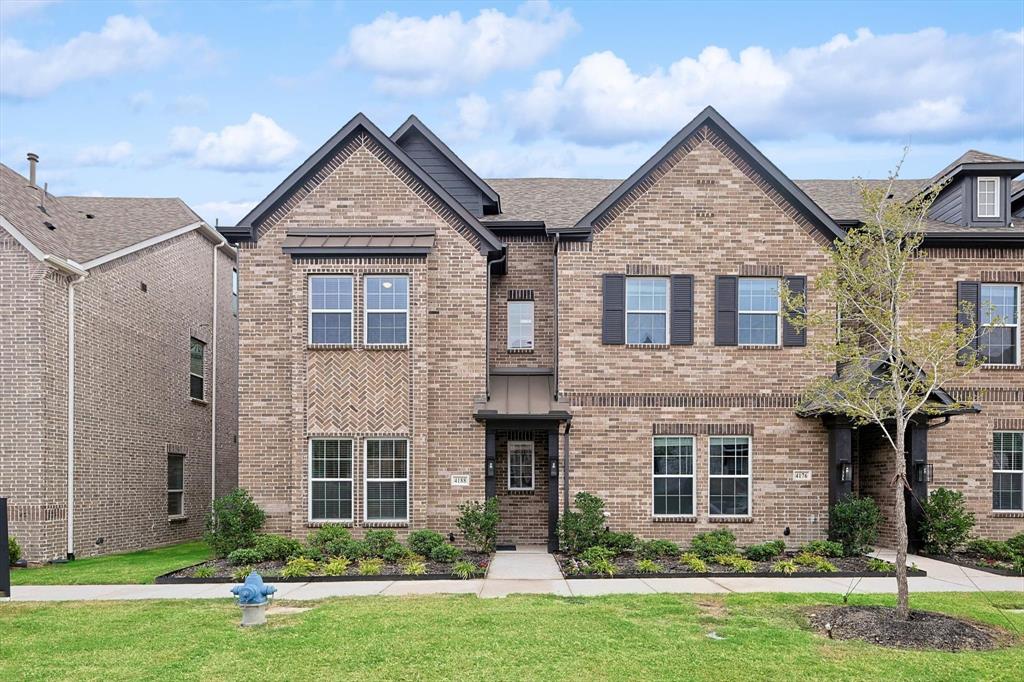 front view of a house with a yard