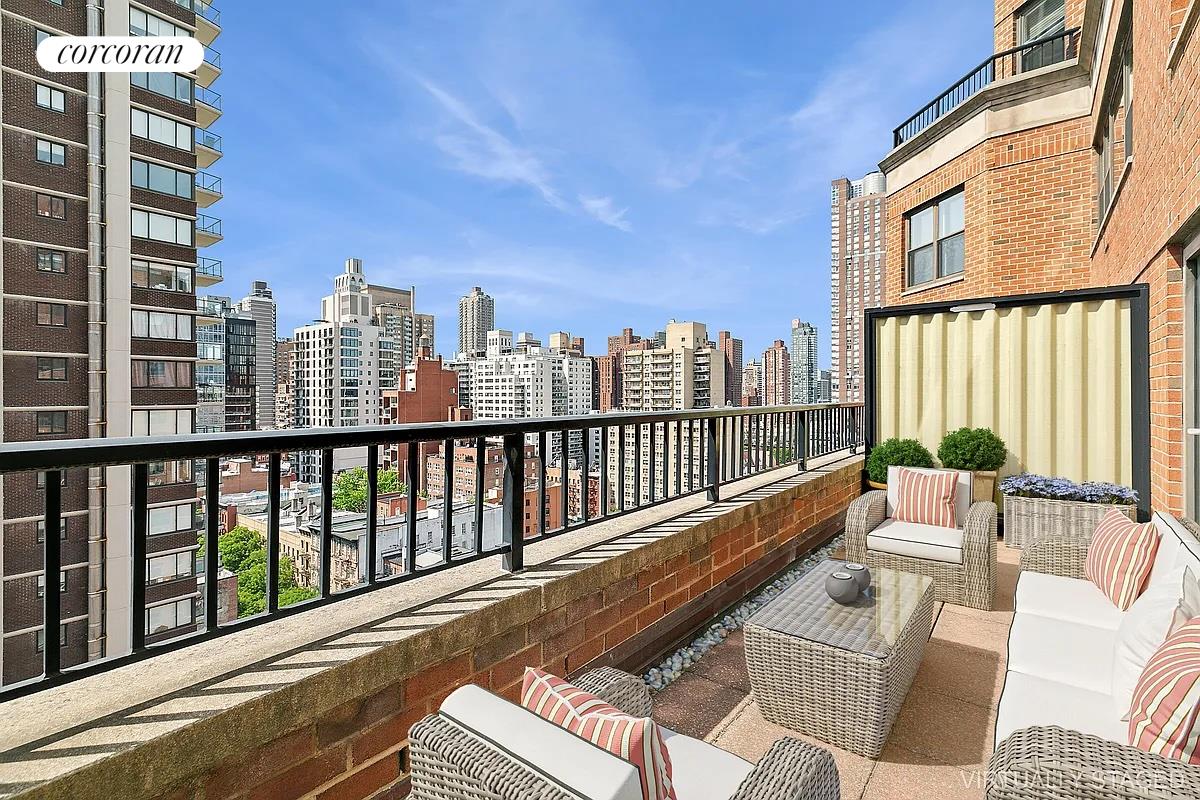 a balcony with couch and wooden floor