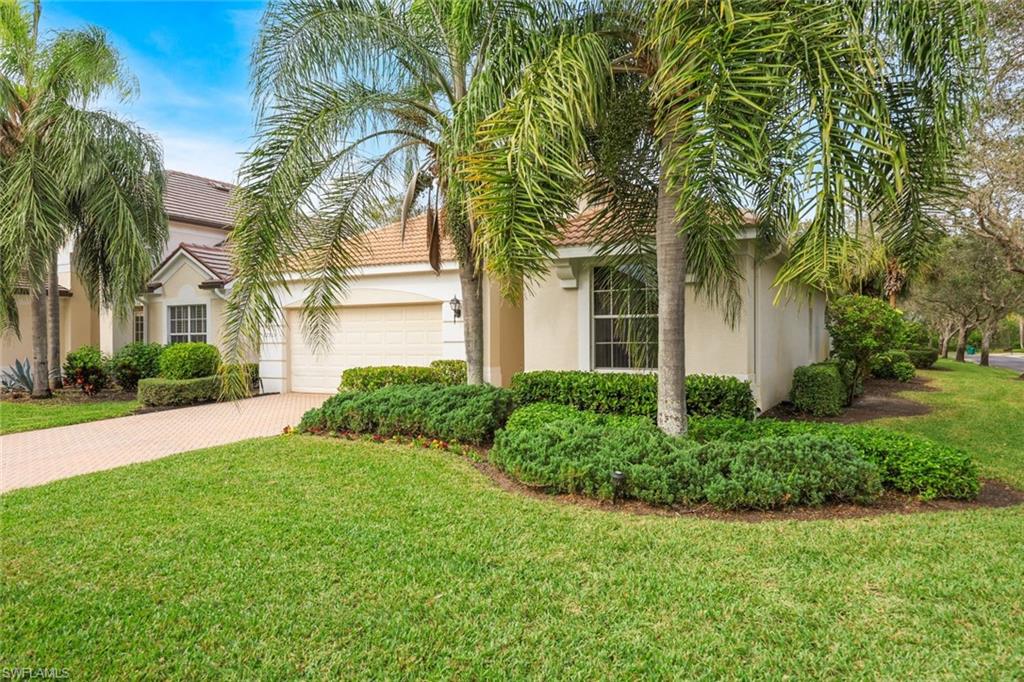 front view of a house with a garden