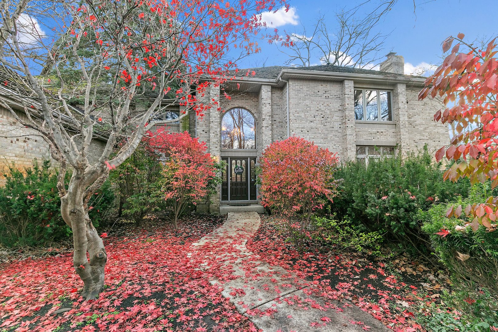 a front view of a house with garden