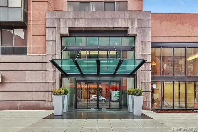 a front view of a building with glass windows and door