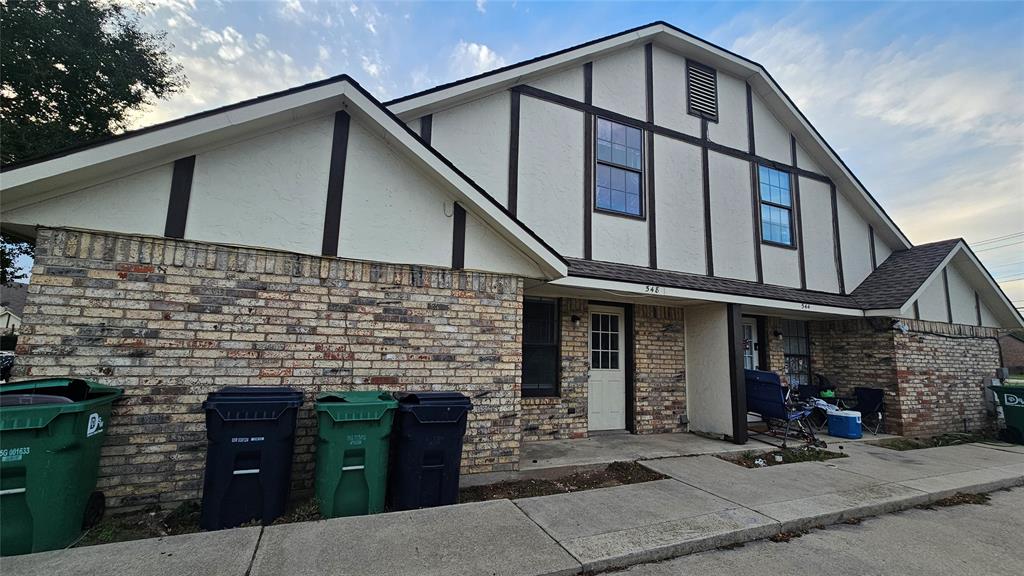 a front view of a house with garage