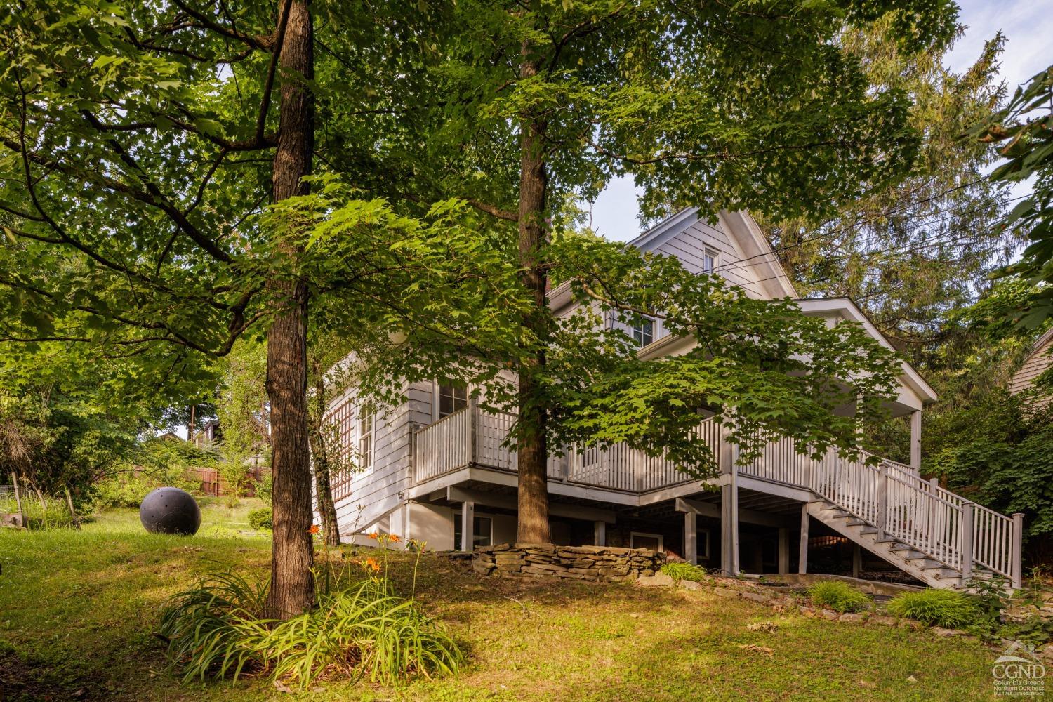 a view of house with trees in the background