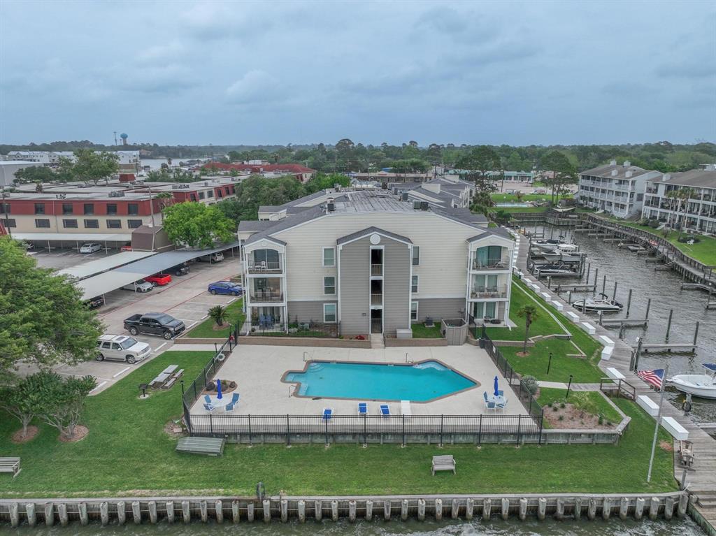 an aerial view of a house with a big yard