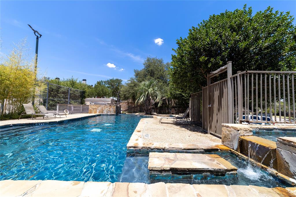 a view of a swimming pool with a lounge chair