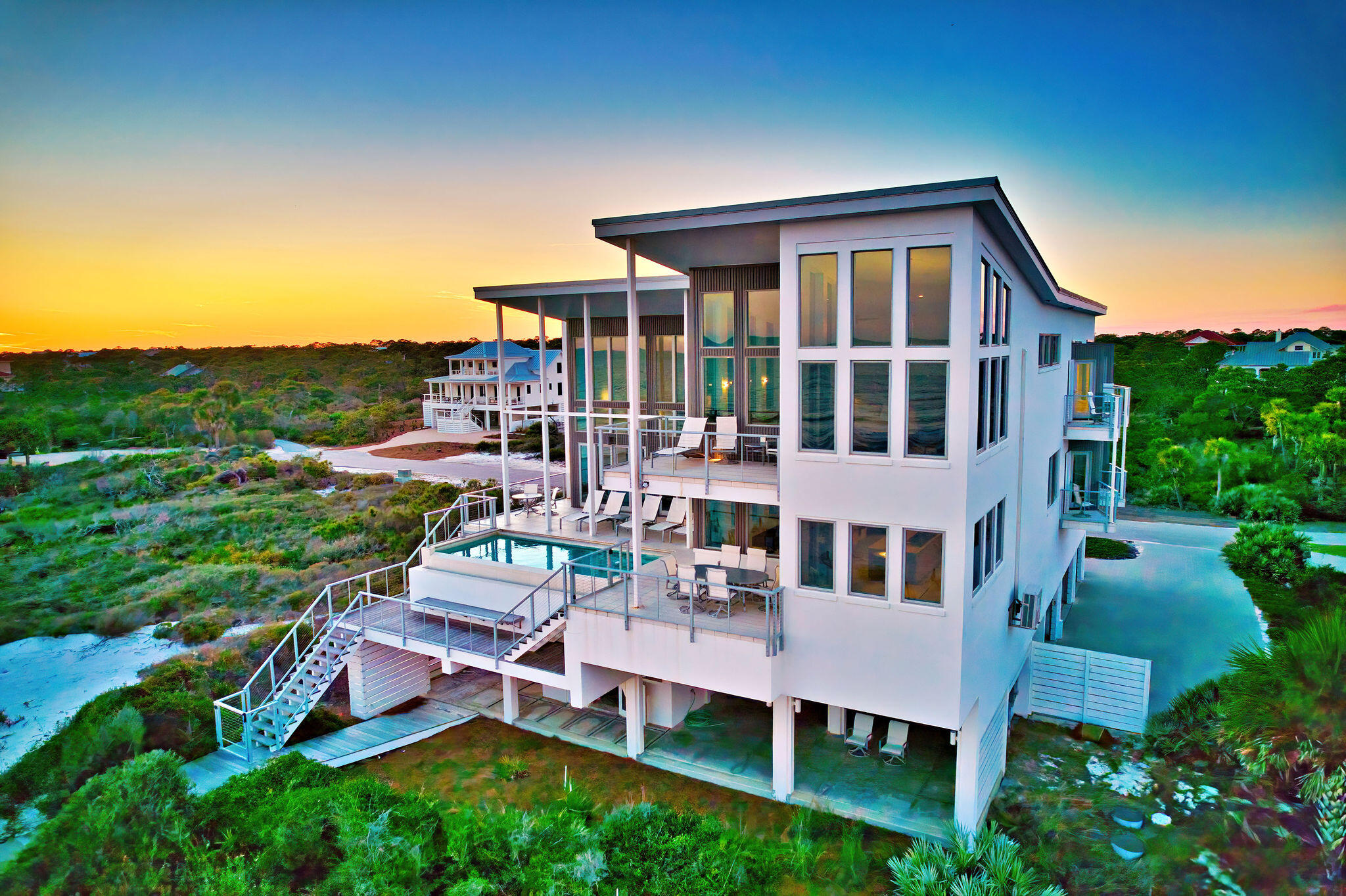 aerial view of a house with backyard porch and sitting area