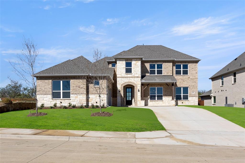 a front view of a house with a yard