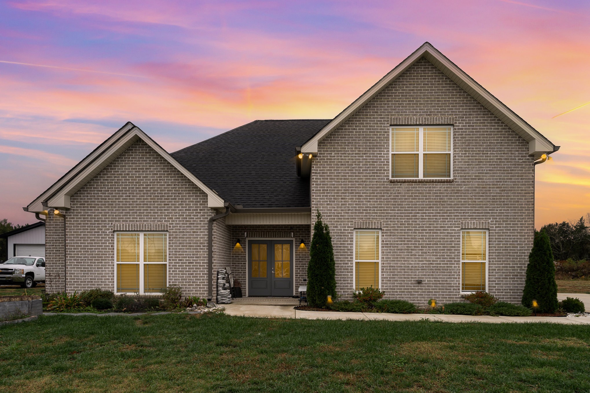 a front view of a house with a yard