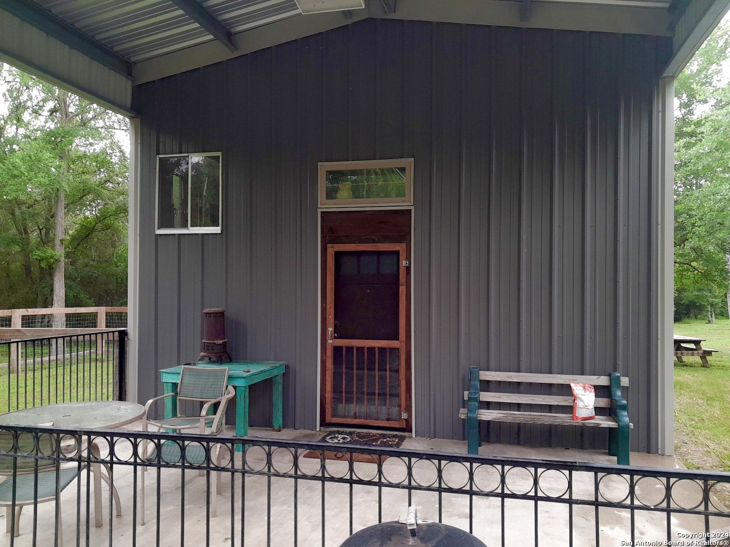 a view of a porch with furniture