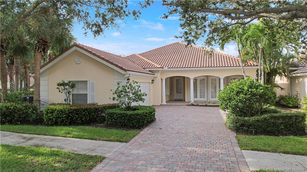 Your Home with Brick paver driveway, mature trees