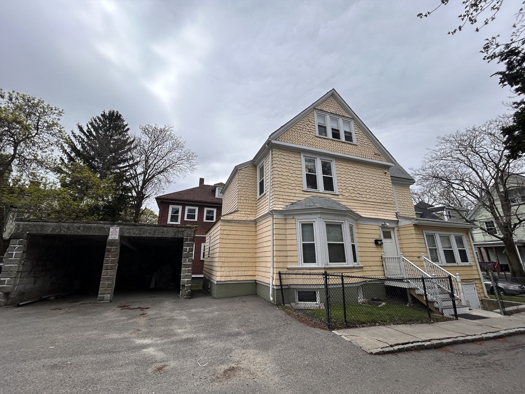 a front view of a house with a garage