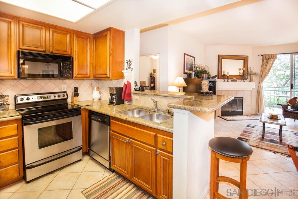 a kitchen with a stove a sink and a microwave