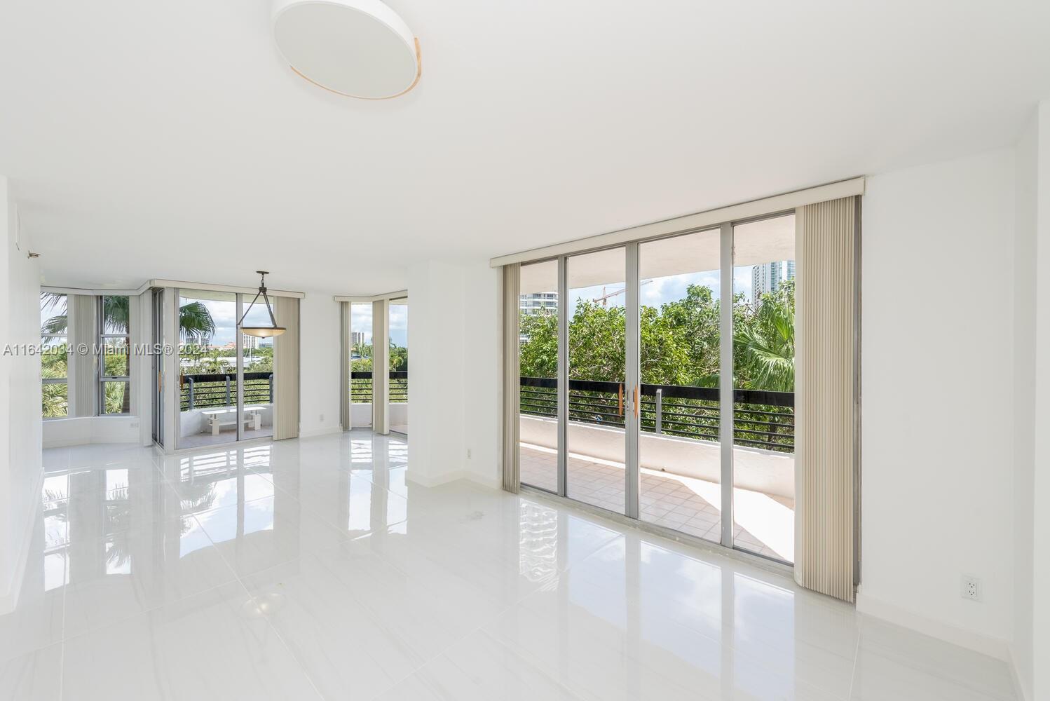 a view of a room with large windows