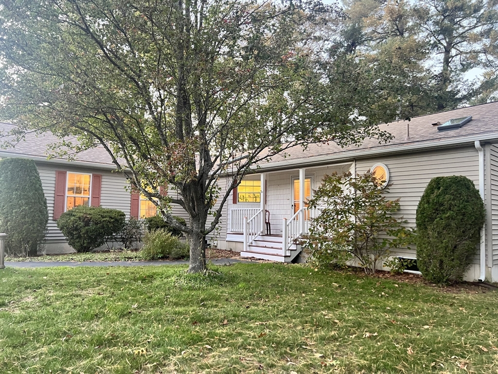 a view of a house with a backyard