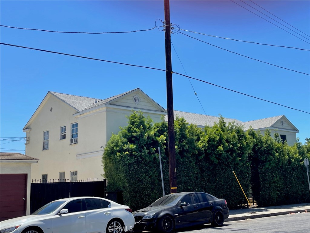 a view of a car parked in front of a house