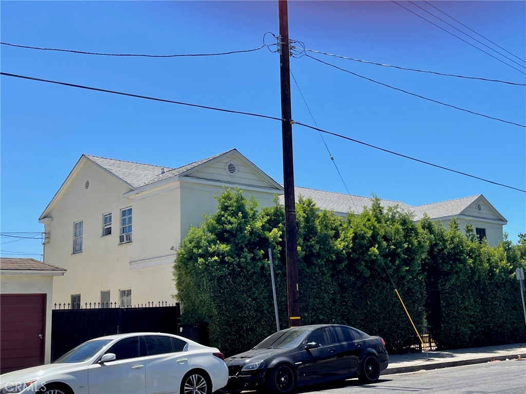 a view of a car parked in front of a house