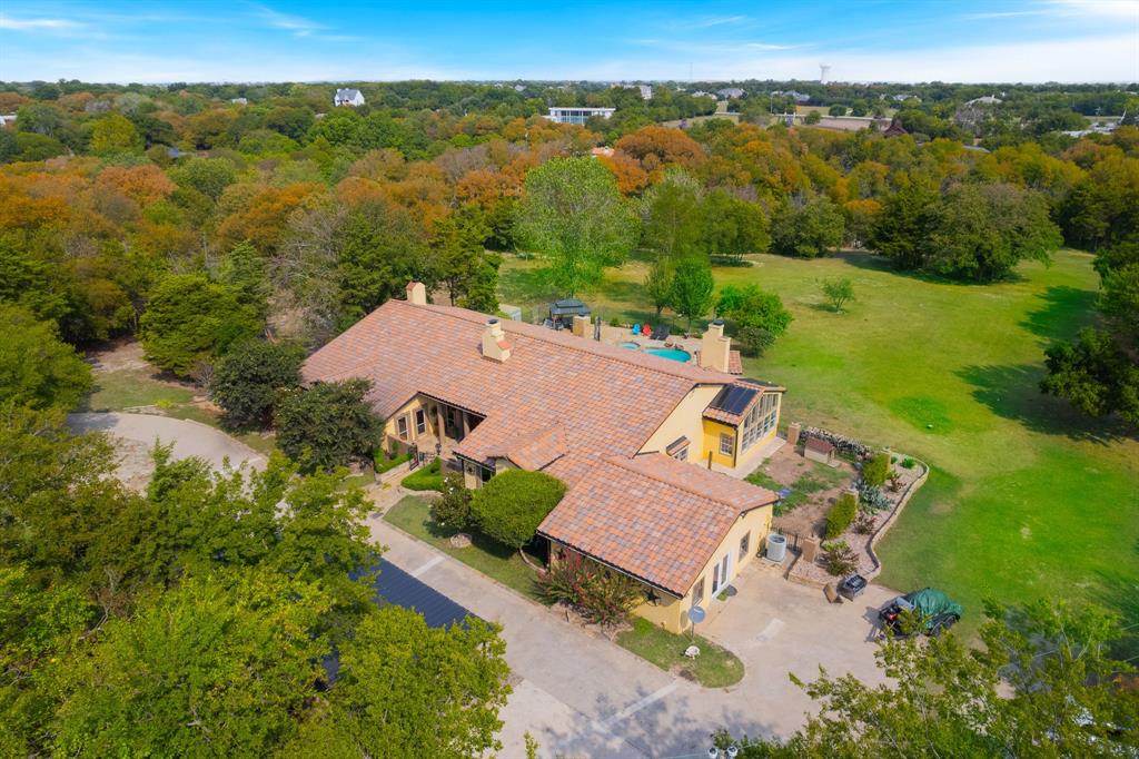 an aerial view of a house with a garden