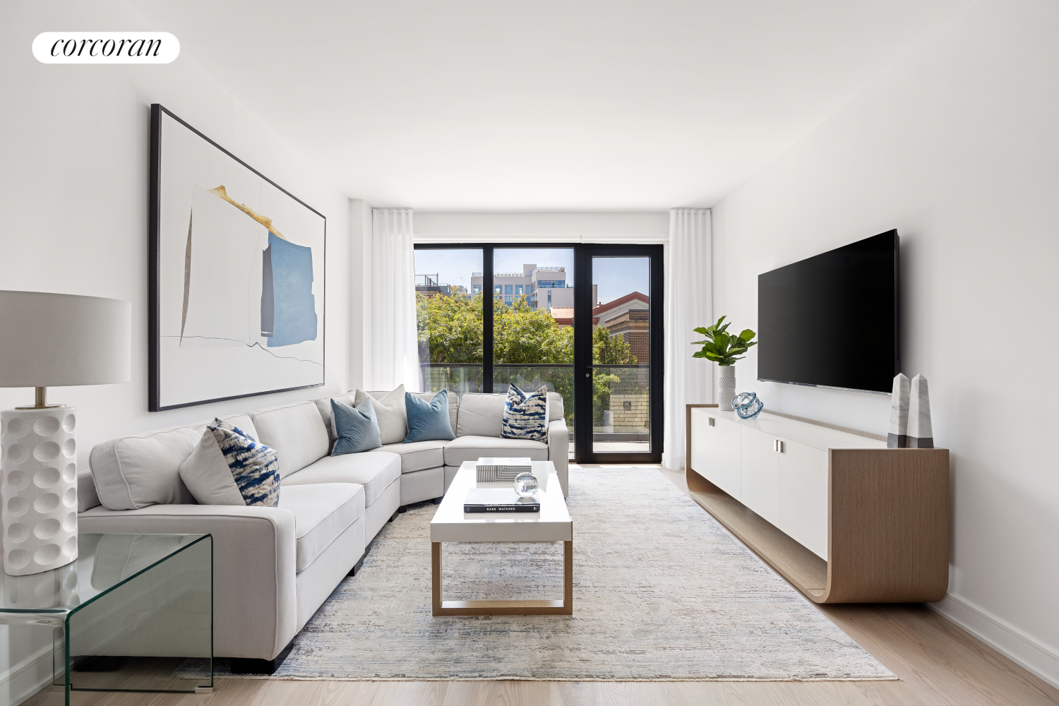 a living room with furniture and a flat screen tv