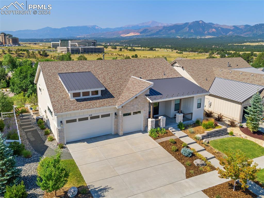 an aerial view of a house with a lake view