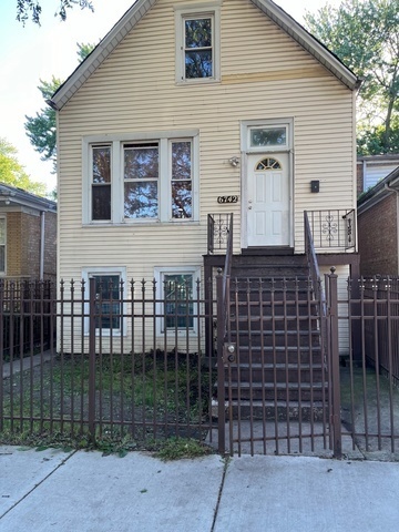 a front view of a house with a glass door